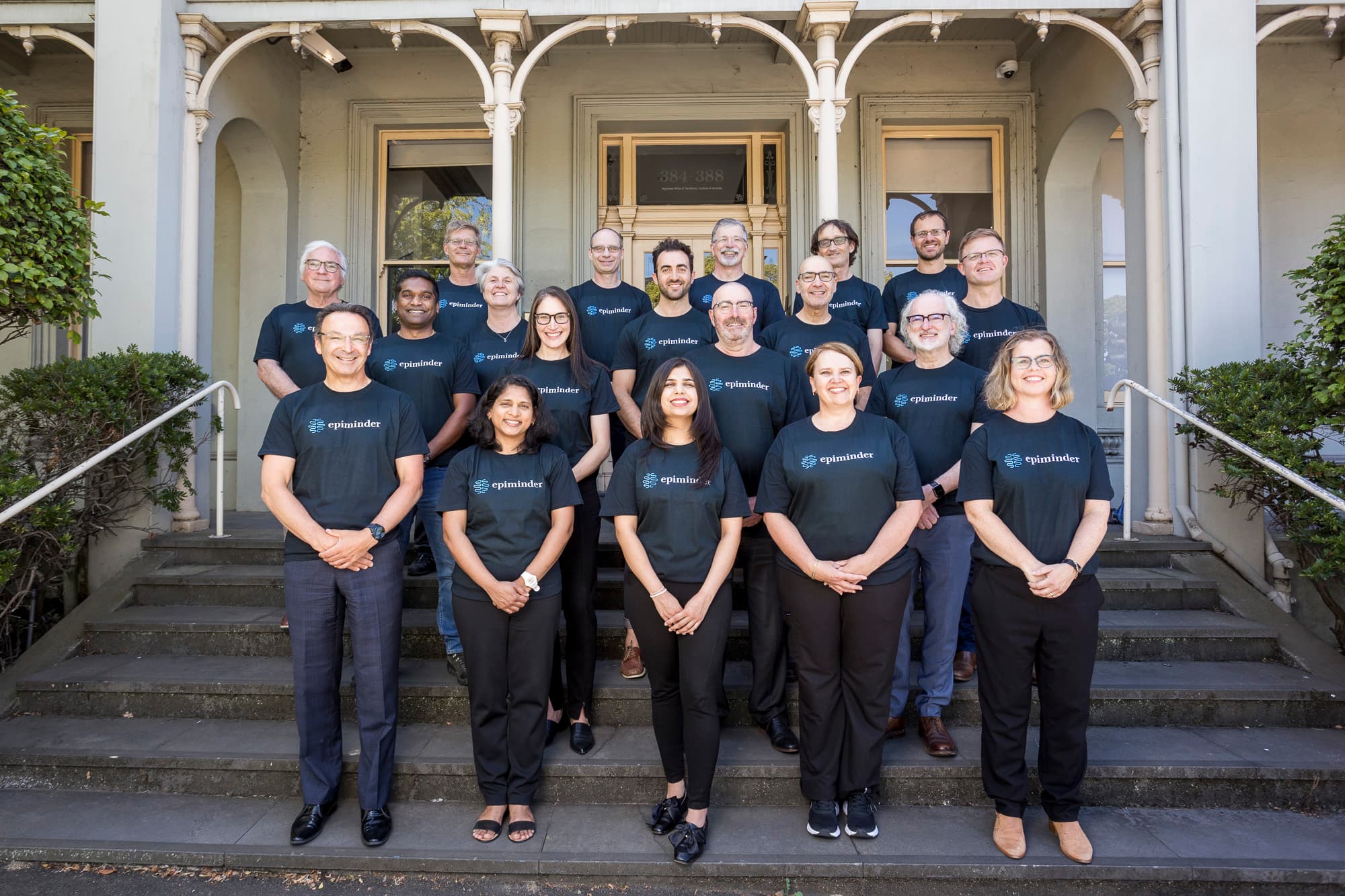 Epiminder team members standing together on building steps